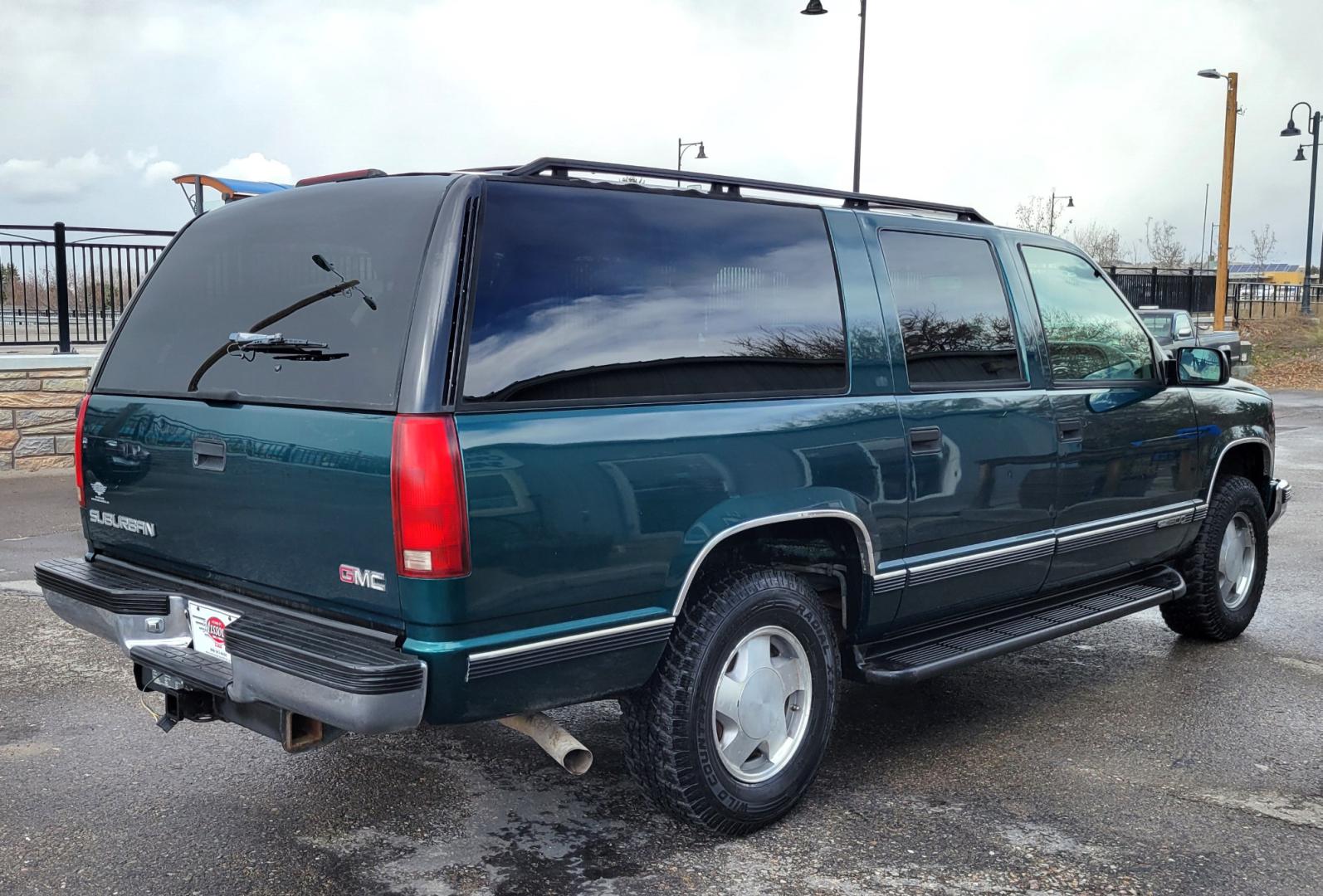 1998 Green /Gray GMC Suburban SLE (3GKFK16R9WG) with an 5.7L V8 engine, 4 Speed Auto transmission, located at 450 N Russell, Missoula, MT, 59801, (406) 543-6600, 46.874496, -114.017433 - 4WD SUV. 5.7L V8 Engine. 4 Speed Automatic Overdrive Transmission. Front and Rear Climate Control. AM FM CD Cassette. Air Cruise. Tilt. Power Front Seats. Power Windows and Locks. Towing. Running Boards. 3rd Row Seating. Because of the Age, financing is not available on this vehicle. - Photo#4
